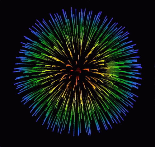 a po of fireworks in the dark with red, green, yellow and blue colors