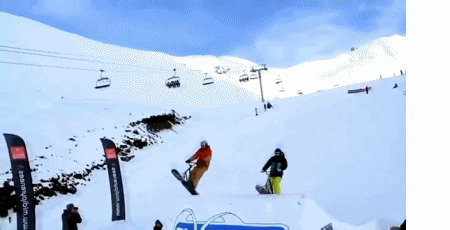 a ski resort has several snowboarders and one skier