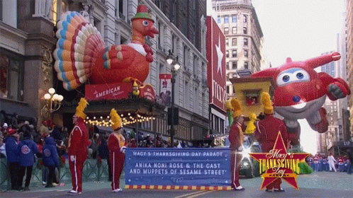 a parade float featuring two seahorses and a fish