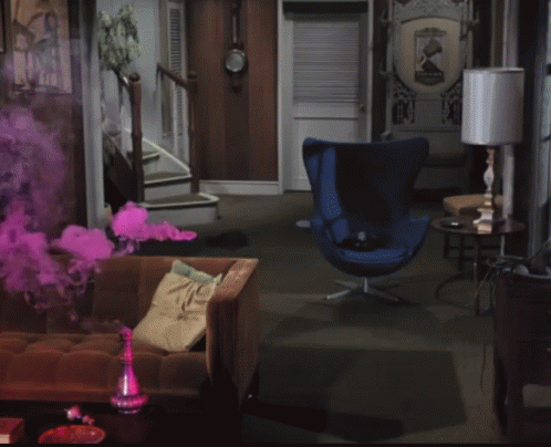 a living room with purple smoke coming from two seats