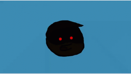 a black object is lit up with glowing blue eyes