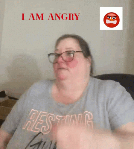 a woman wearing glasses that read i am angry