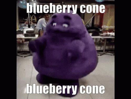 a person in a blueberry conte character sits on the floor