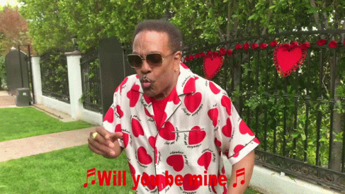 a black man dressed in an african style shirt