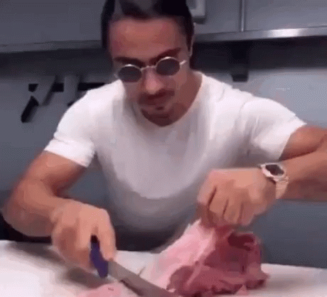 a man using scissors to cut some kind of plastic thing