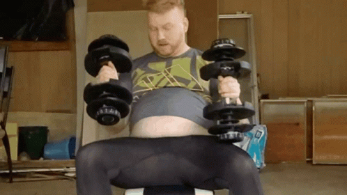 a man is sitting on top of a stool while doing exercises with dumbbells