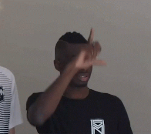 two black men wearing shirts that have one finger up