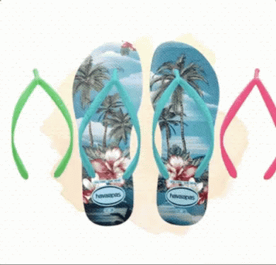 three pairs of sandals are lined up in the background