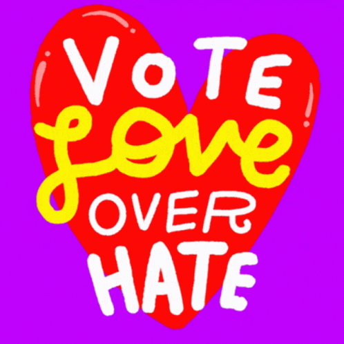 the words vote over hate on a heart shaped sign