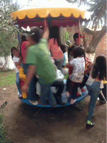 people in a rickshaw ride and play