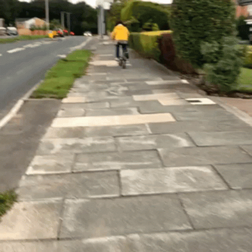a man on a bicycle in the street