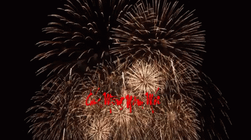 a large fireworks display with words written in the middle