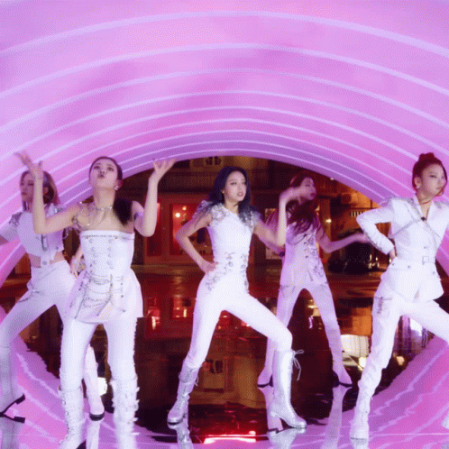 five female dancer's in front of purple background