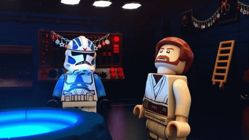 two lego figures sitting together in the shape of stormtroos