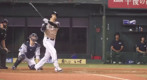 a baseball player swinging his bat at a game