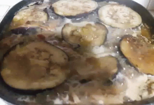 food is cooking in a pan on the stove