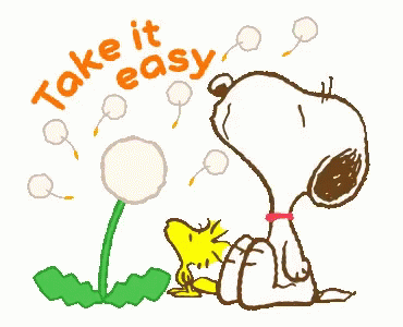 the snoopy  is blowing soap on his head
