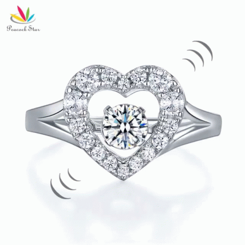 an elegant heart shaped ring with white diamonds on the side