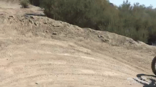 a dirt bike is parked in the middle of some hills