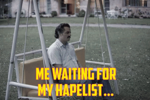 a man is sitting on a swinging chair and staring