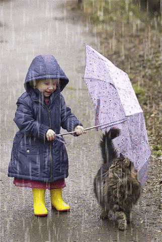 a little girl that is holding an umbrella
