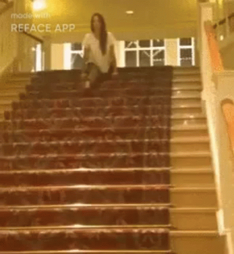 there is a woman sitting on some stairs