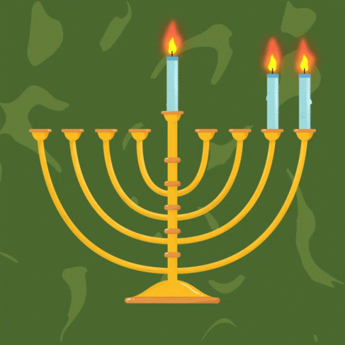 a candle and some blue candles on a green background