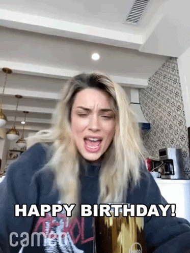 a person with long hair and face paint has a birthday card saying happy birthday