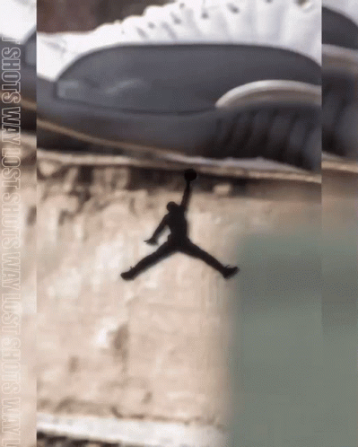 a pograph of the air jordans above a water fall