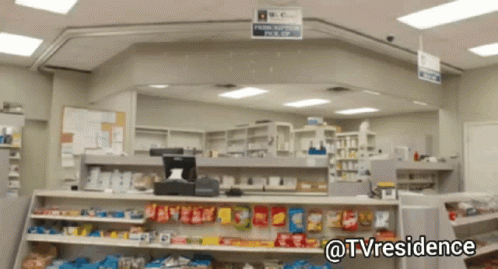an empty pharmacy building with many shelves