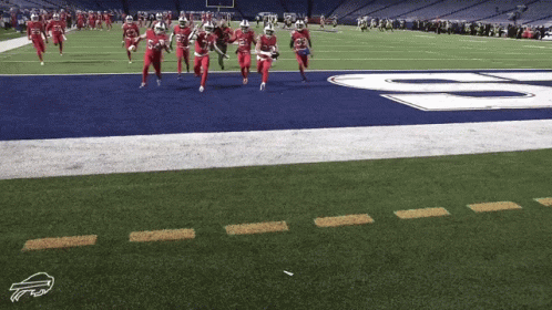 a group of cheerleaders dancing before a football game