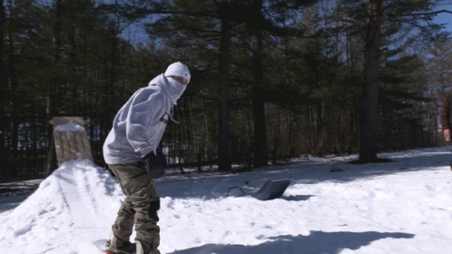 a person on a skate board riding on some snow