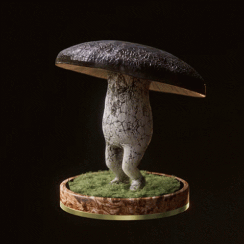 a very unusual looking sculpture with a large mushroom on its head