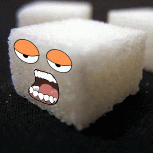 a close up of a sugar cube with an angry face
