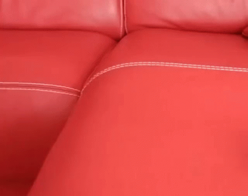 a couch that has been dyed blue with a white stitching and stitching pattern