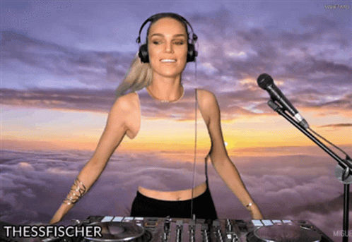 an animated female dj with headphones sitting at a desk