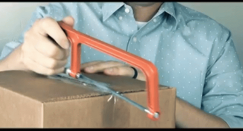 a man opens a metal package with a blue opening rod