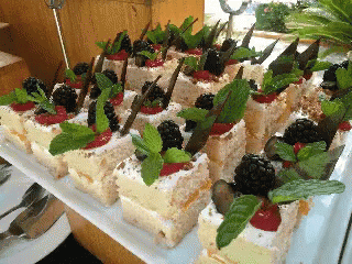 desserts decorated like nature are set out on a counter