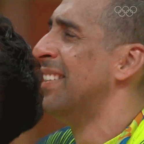 the male olympic official kiss for the camera