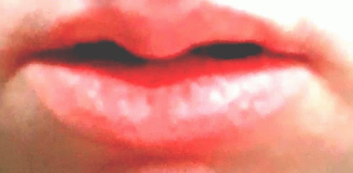 a close up view of the bottom portion of a person's mouth and lower half