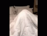 an image of a woman laying in bed with a white blanket