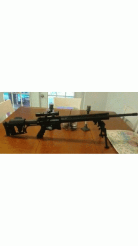 an airsoft rifle sits on the floor and ready for reloading