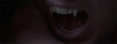 the mouth of a person showing large teeth