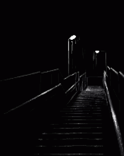 two sets of stairs with light at end