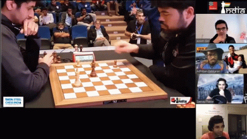 a video game scene with men playing a chess game