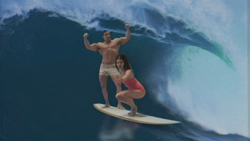 a po of two people on a surf board and a large wave