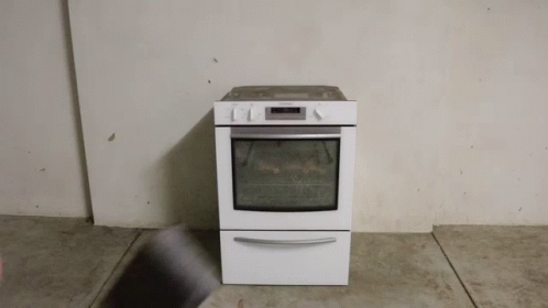 a small white oven in a room