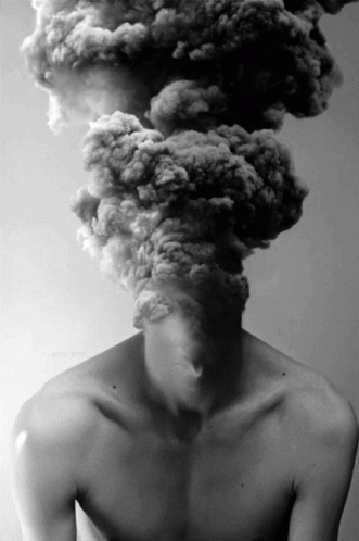 a person with their head in a smokestack