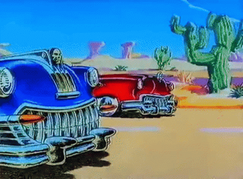 vintage automobiles sit in front of the cactus on a desert sunset
