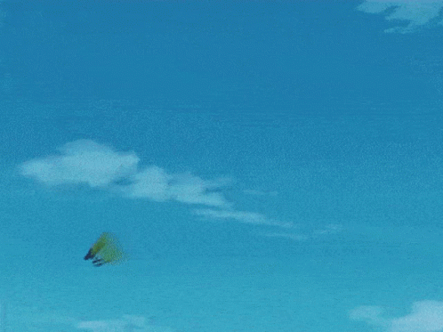 a man riding a kiteboard down a sandy beach